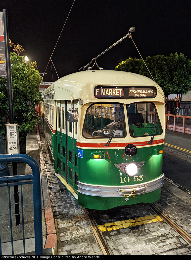 View of cars 1055 and 1061 lined up at the stop on Jones Street